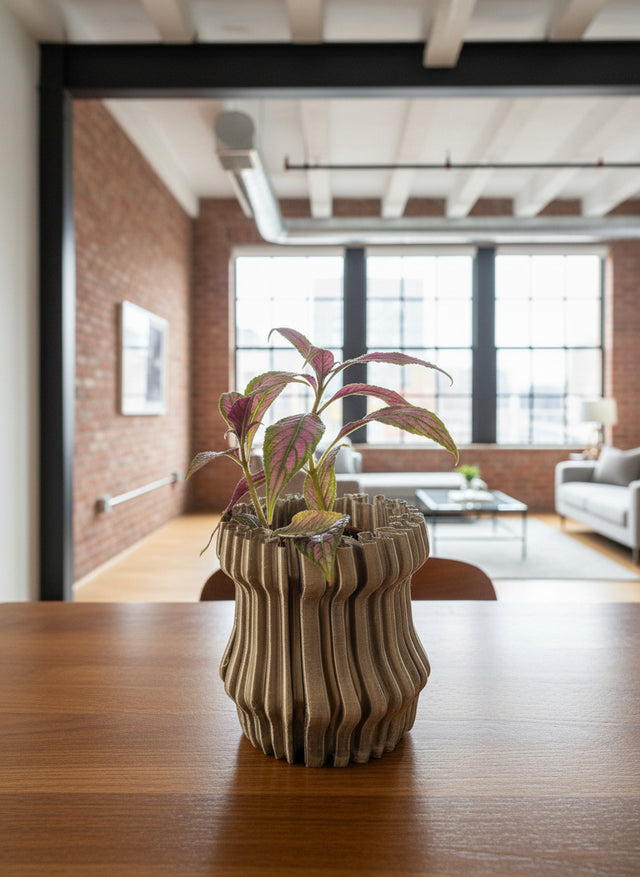Potted plant on a wooden table in a modern office setting